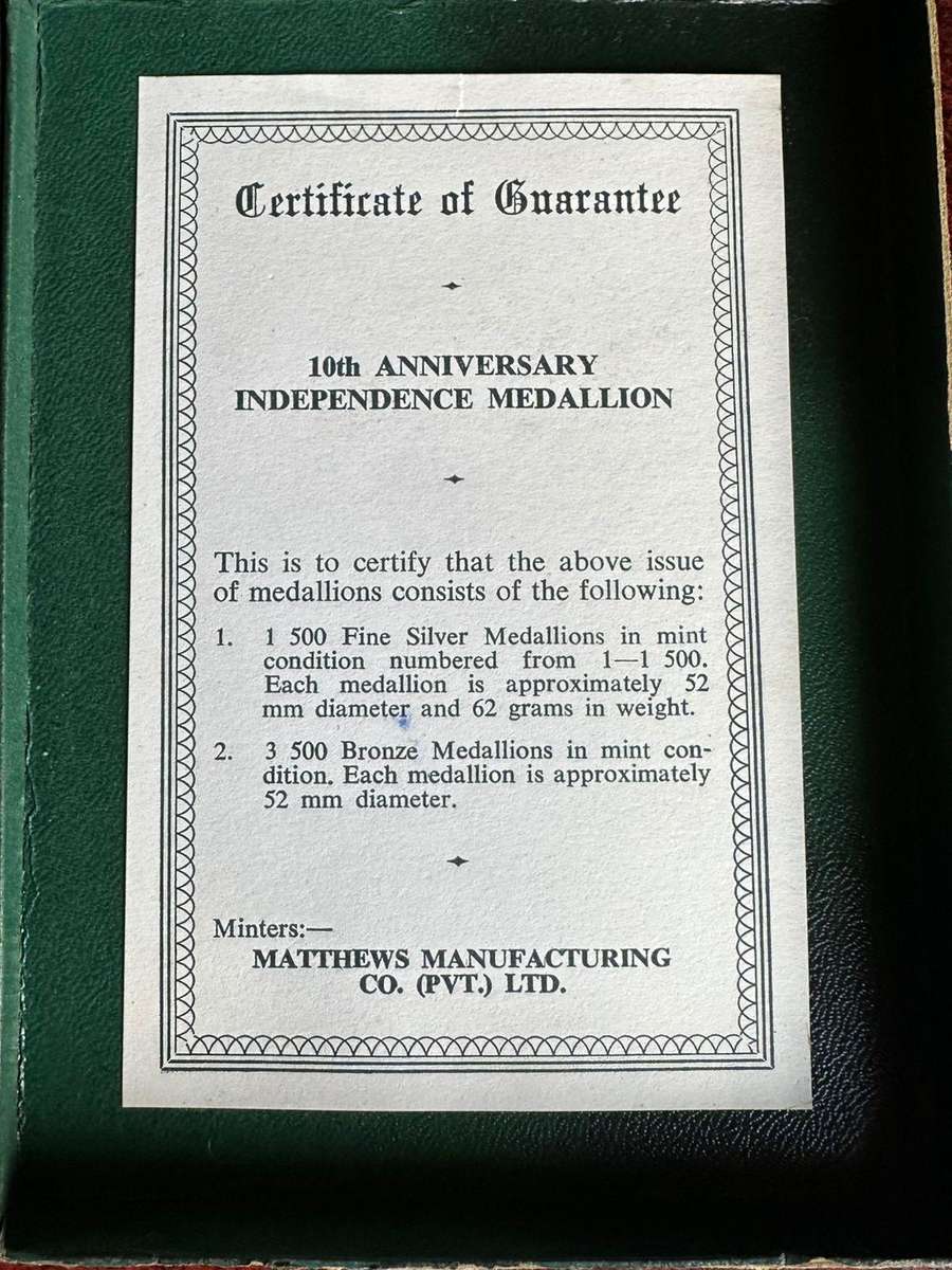 Boxed bronze Rhodesian Independence medallion.