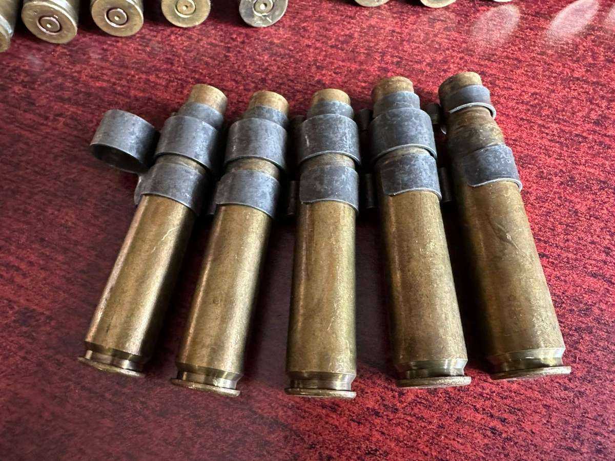 12,7 M4 machine gun belts. 3 Pieces with spent cartridges.