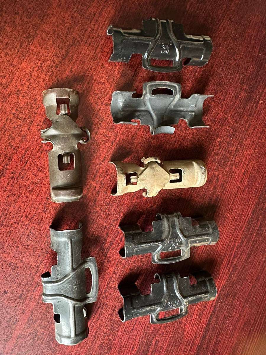 Selection of 7 30mm R1 A2 machine gun belt clips.