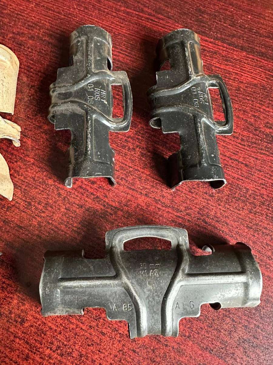 Selection of 7 30mm R1 A2 machine gun belt clips.