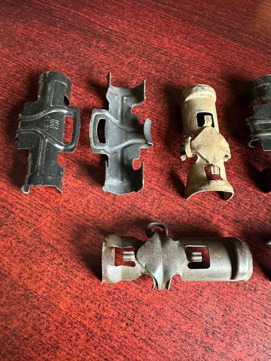Selection of 7 30mm R1 A2 machine gun belt clips.