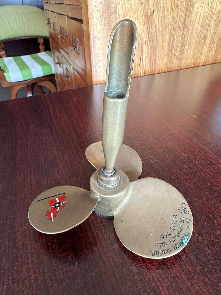 Brass propeller made into a pen holder. Diameter at the bottom 11,5cm, height 13 cm.