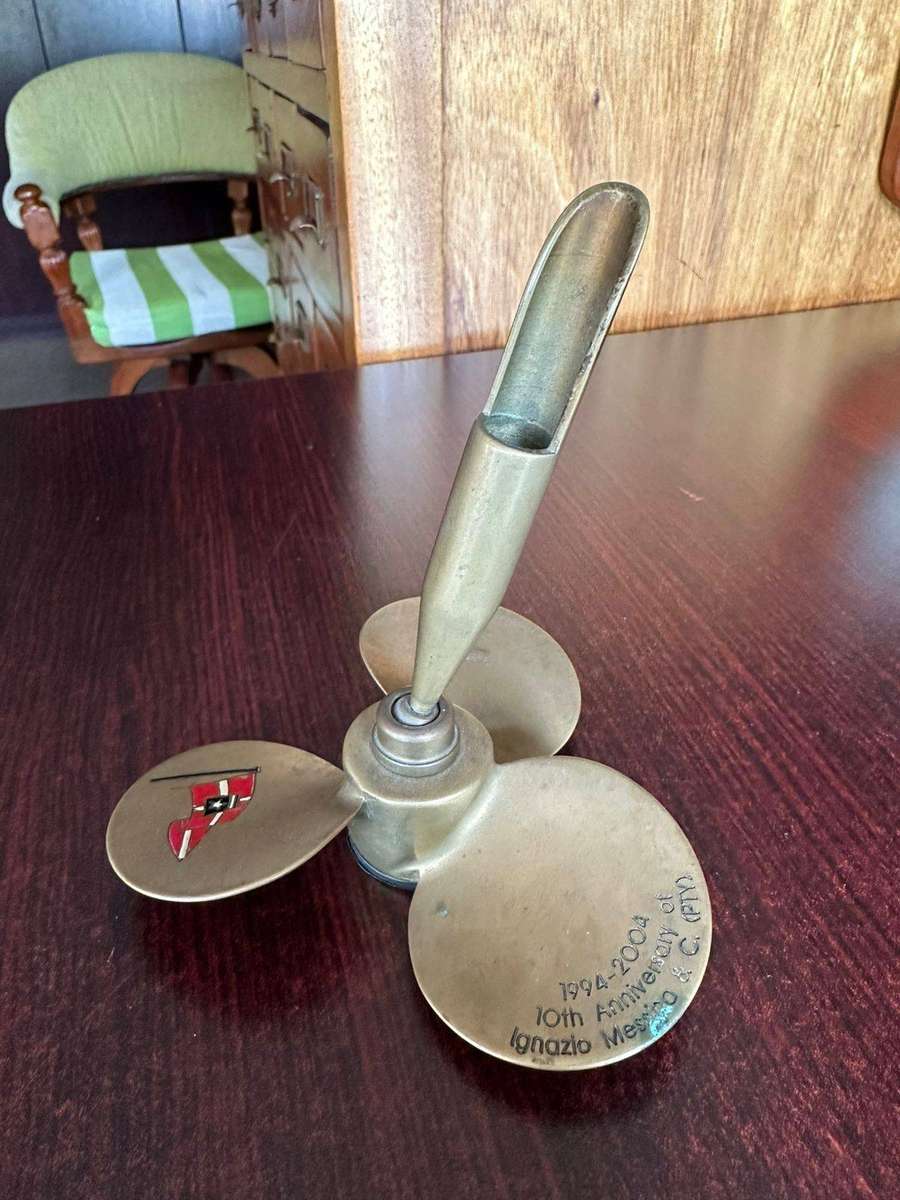 Brass propeller made into a pen holder. Diameter at the bottom 11,5cm, height 13 cm.