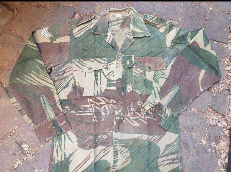 Original Rhodesian long sleeve camo shirt with Sgt. rank and custom added "pocket knife" pouch. No d