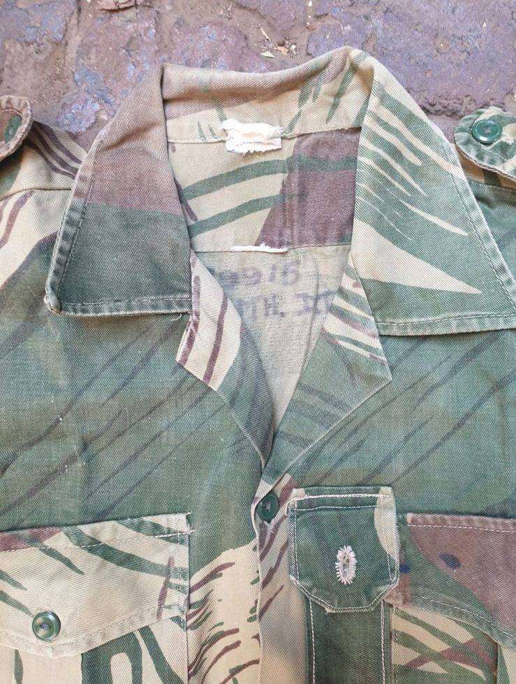 Original Rhodesian long sleeve camo shirt with Sgt. rank and custom added "pocket knife" pouch. No d