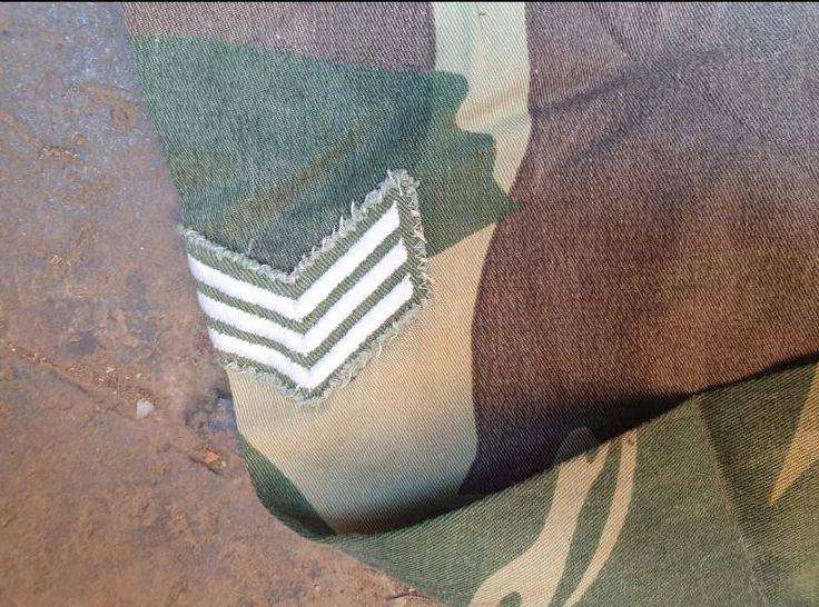 Original Rhodesian long sleeve camo shirt with Sgt. rank and custom added "pocket knife" pouch. No d