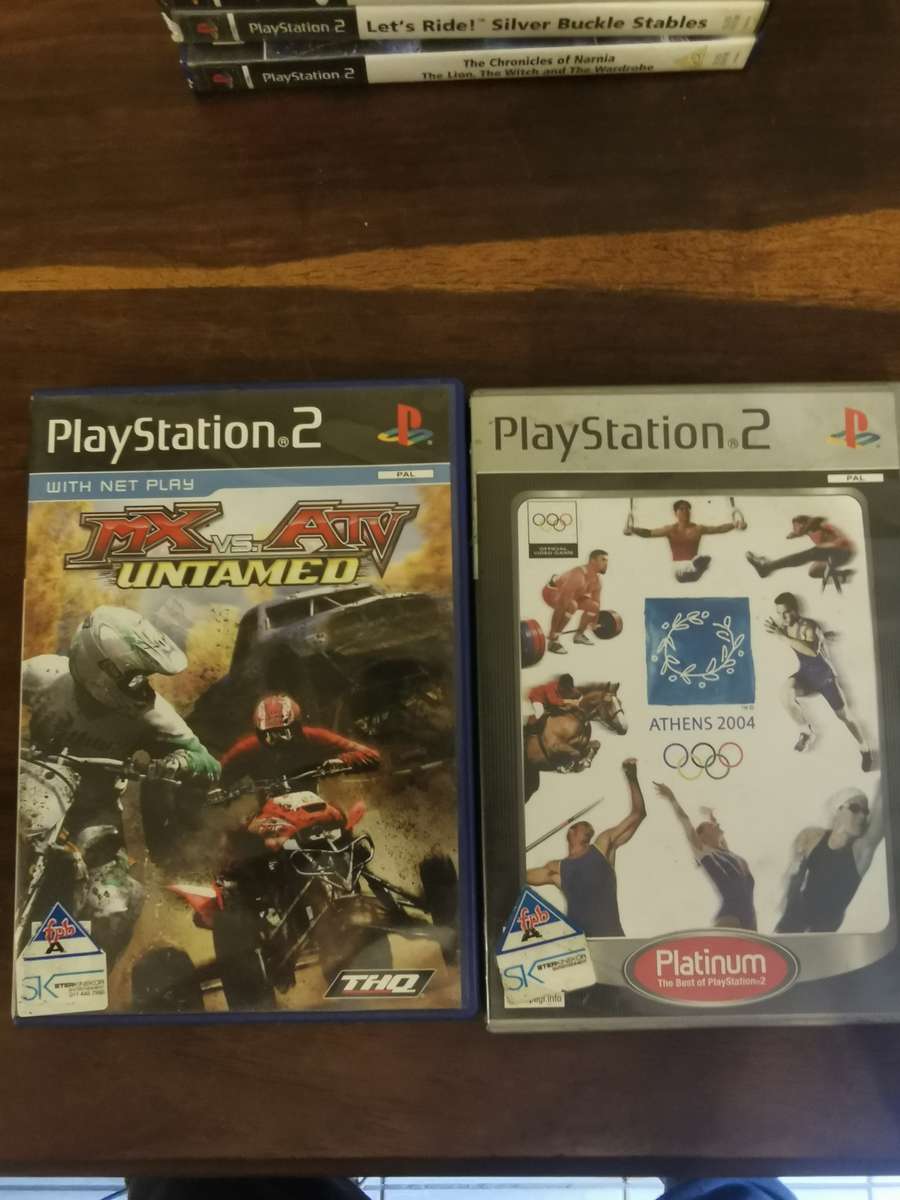 Massive Collection of PlayStation 2 Games with a Memory Card and Original Remote