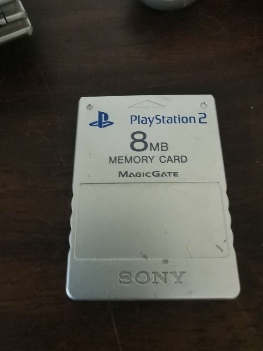 Silver PlayStation 2 Console Complete with x7 Free Games