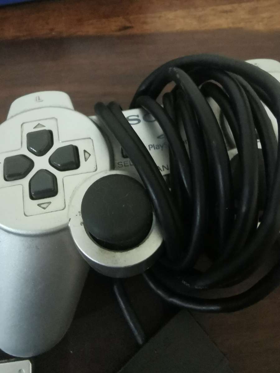 Silver PlayStation 2 Console Complete with x7 Free Games