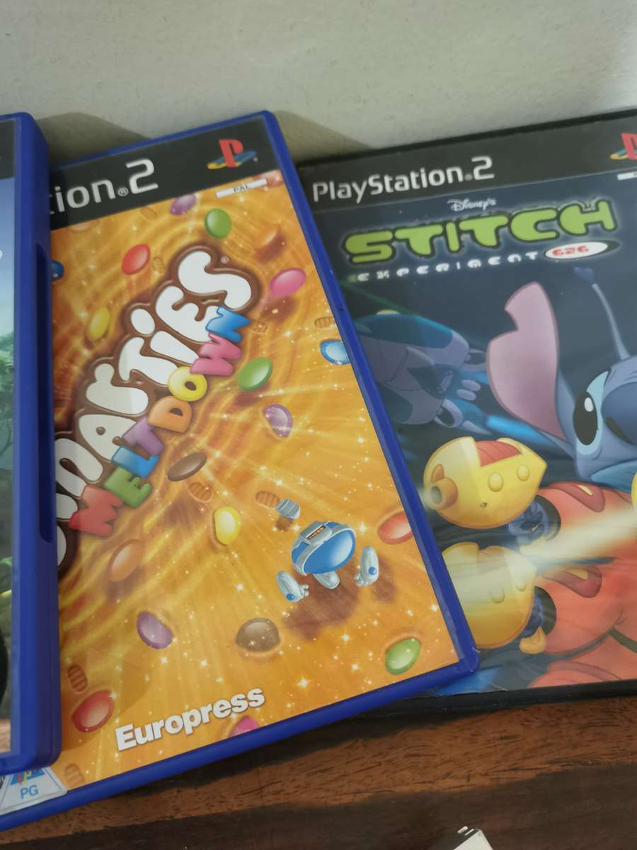 Silver PlayStation 2 Console Complete with x7 Free Games