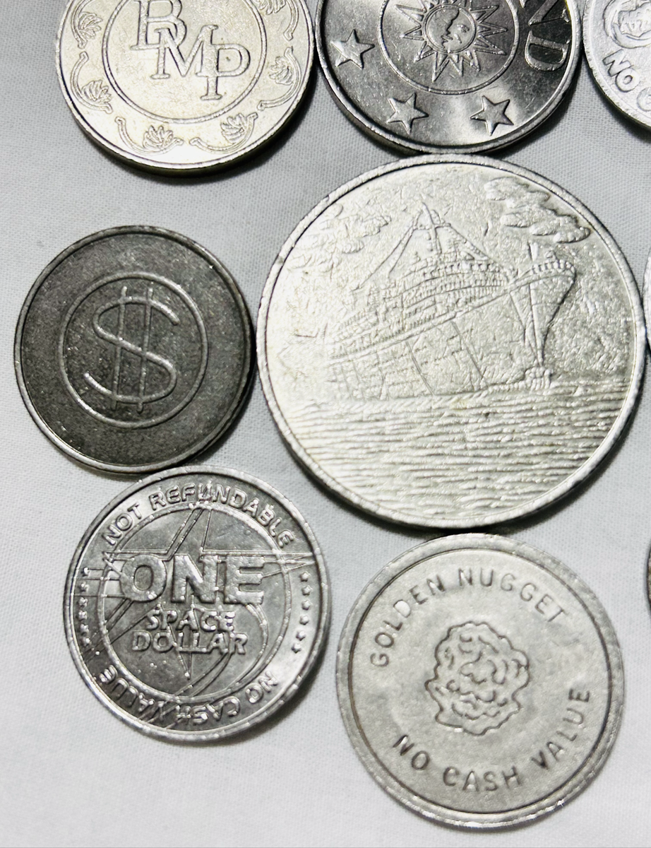 Twelve x Casino tokens all different as one lot Relict non payment.