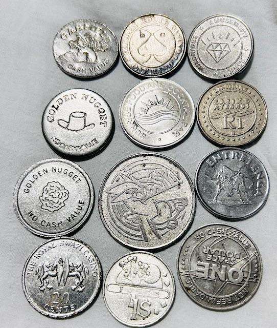 Machine token mix lot (12) tokens over the world- Pokeman token included