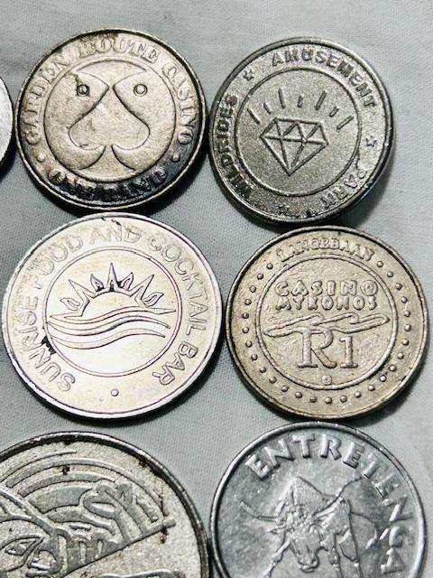 Machine token mix lot (12) tokens over the world- Pokeman token included