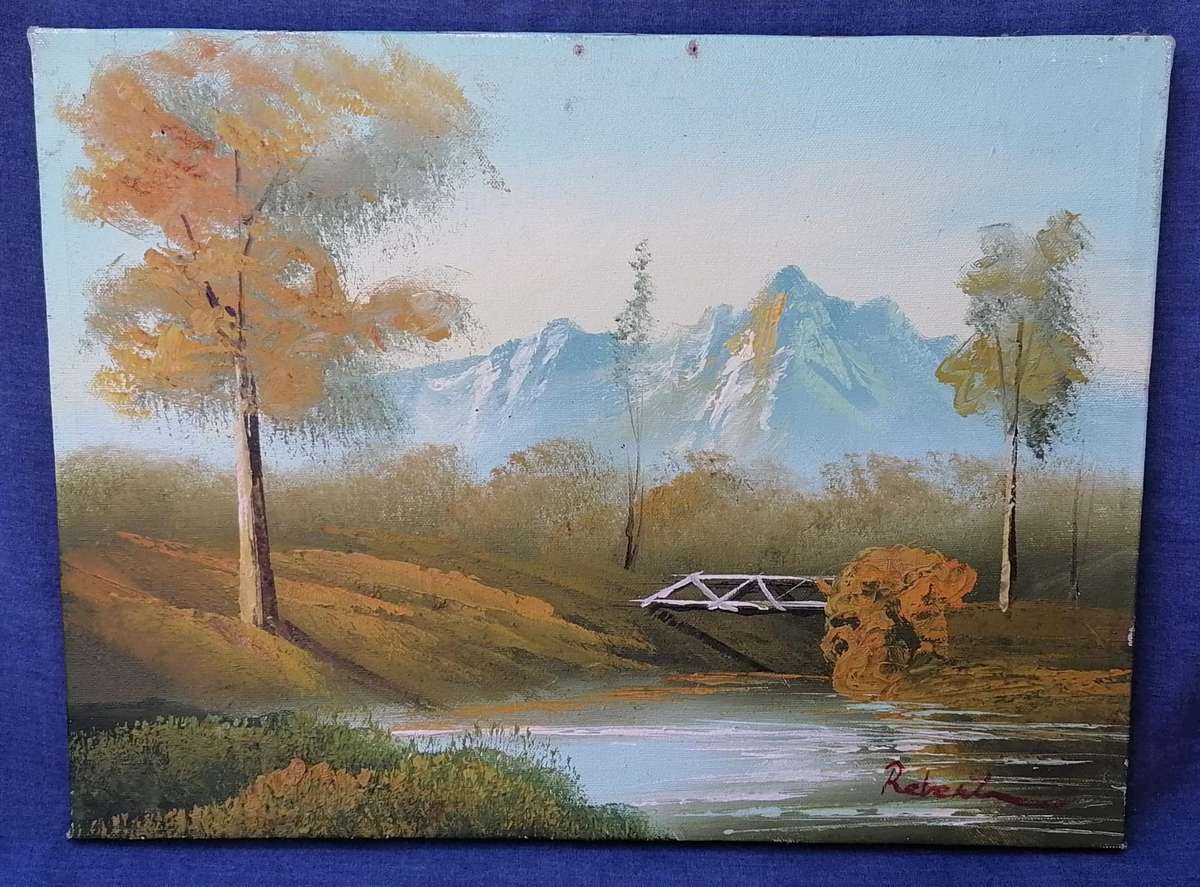 PAINTING ON BLOCK MOUNT CANVAS OF BRIDGE BELOW SNOWY MOUNTAIN-ARTIST SIGNATURE ILLEGIBLE