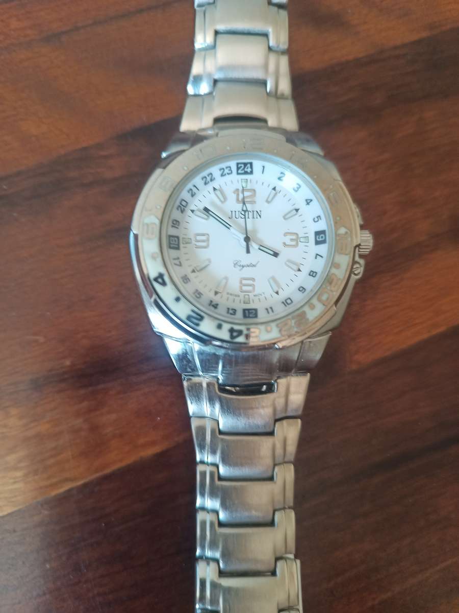 Justin men's watch and a Sandoz ladies watch