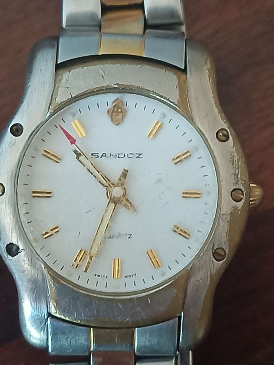 Justin men's watch and a Sandoz ladies watch