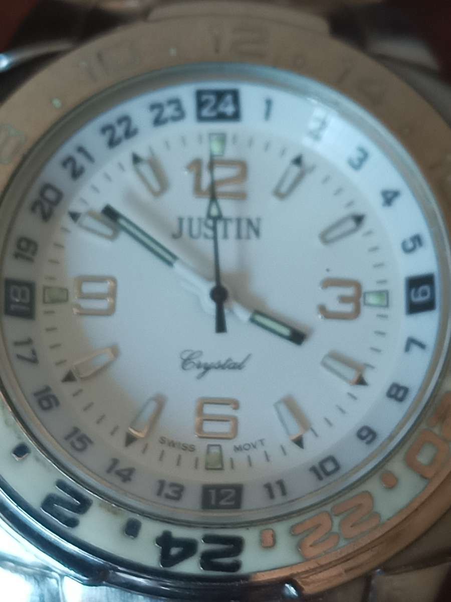Justin men's watch and a Sandoz ladies watch