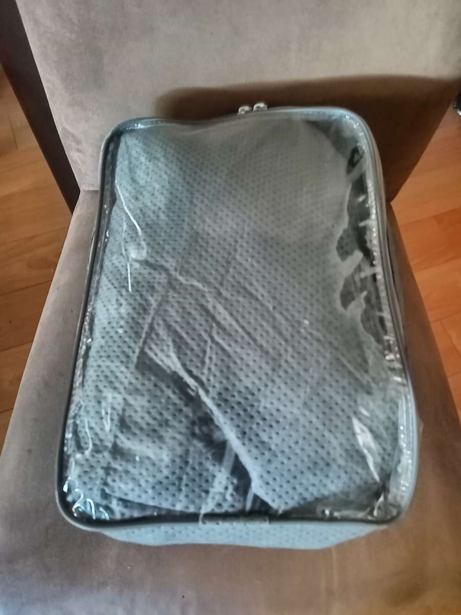 Motorcycle protective cover in bag