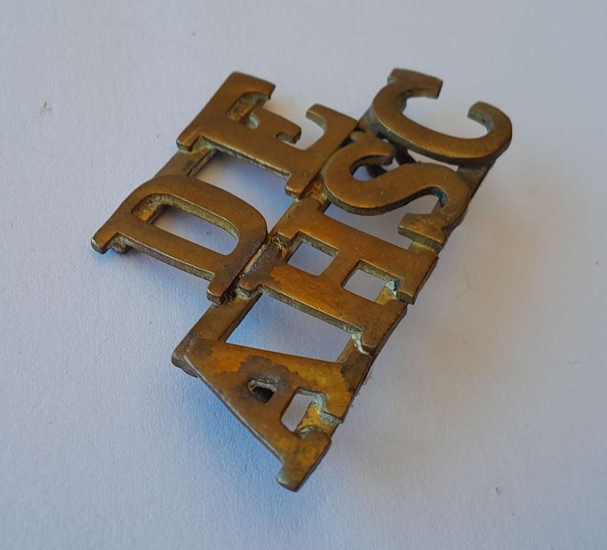 Early DEAHSC Brass Shoulder Title. Lugs Intact.