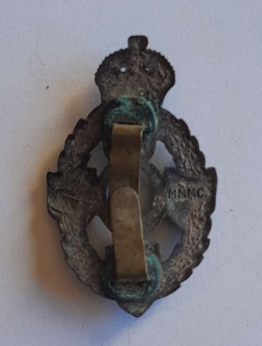 WW2 Royal Electrical Mechanical Engineers Badge.  Clasp Intact.