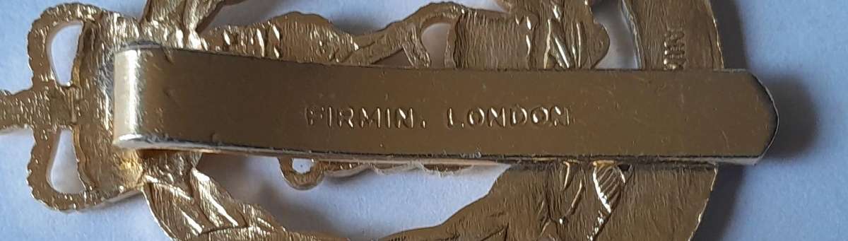 British Adjutant Generals Corps Anodised Aluminium Cap Badge By Firmin.  Slider Intact.