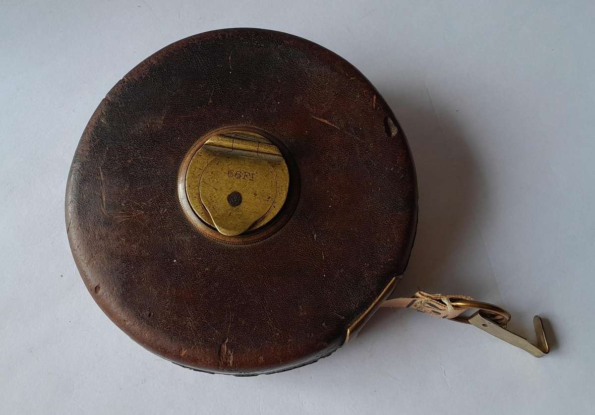 Antique Leather Cased 66ft Wind Up Measuring Tape with Brass Handle.