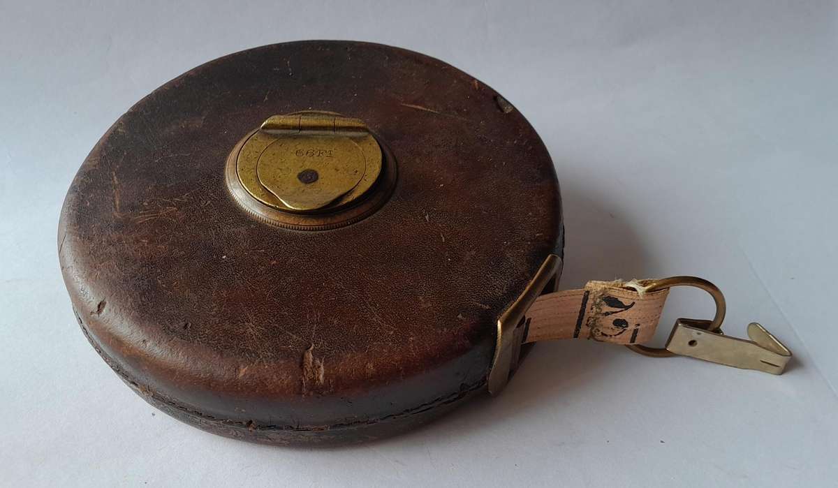 Antique Leather Cased 66ft Wind Up Measuring Tape with Brass Handle.