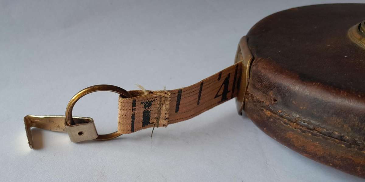 Antique Leather Cased 66ft Wind Up Measuring Tape with Brass Handle.