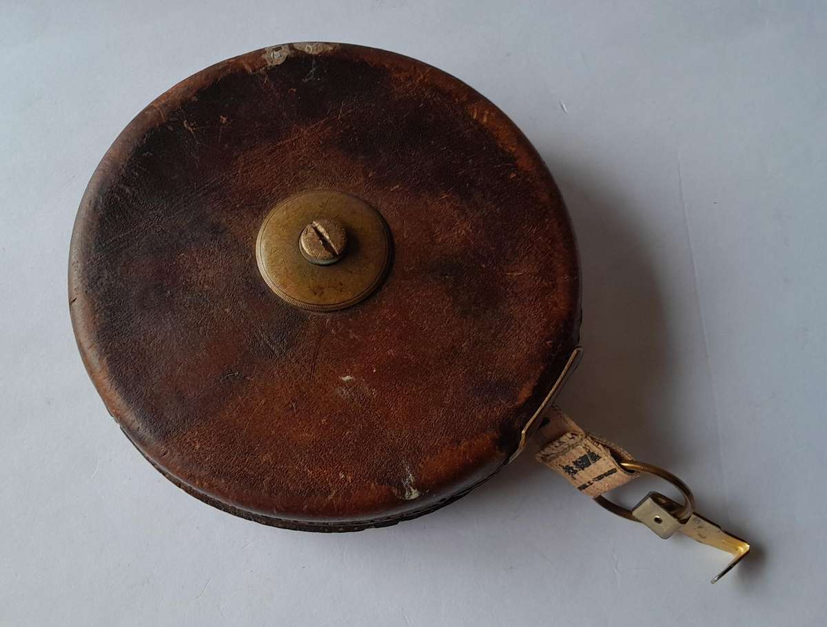 Antique Leather Cased 66ft Wind Up Measuring Tape with Brass Handle.