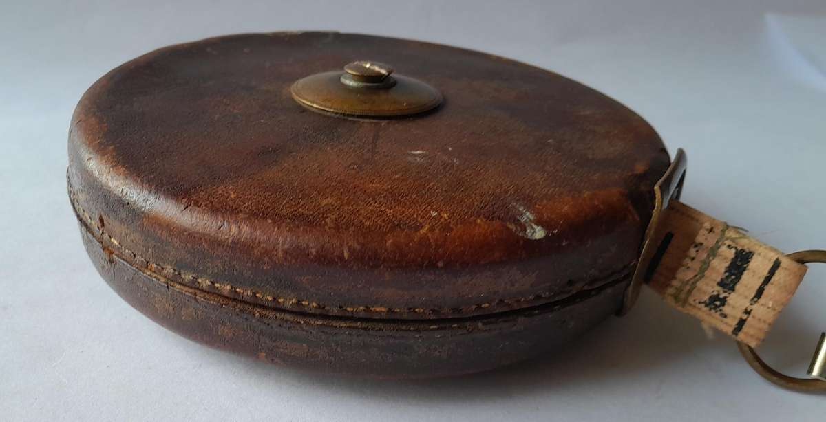 Antique Leather Cased 66ft Wind Up Measuring Tape with Brass Handle.