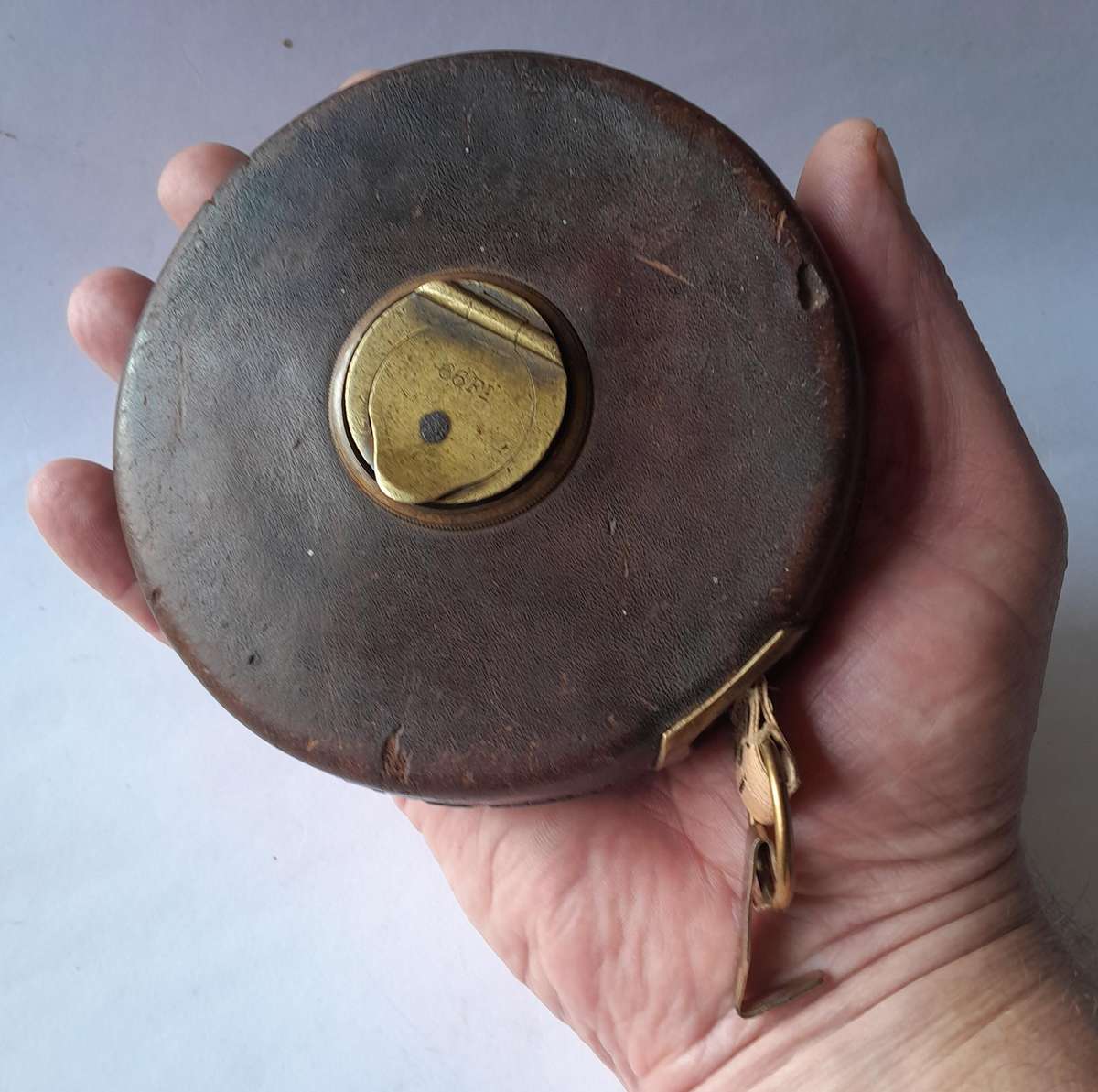 Antique Leather Cased 66ft Wind Up Measuring Tape with Brass Handle.