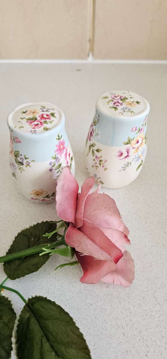 Pair of floral ceramic cellars