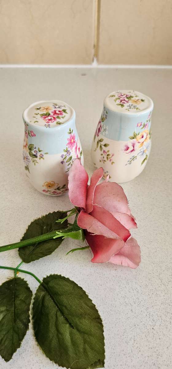 Pair of floral ceramic cellars