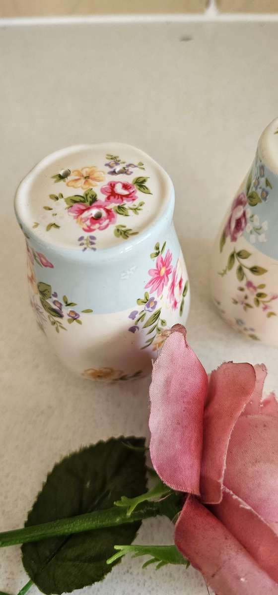 Pair of floral ceramic cellars