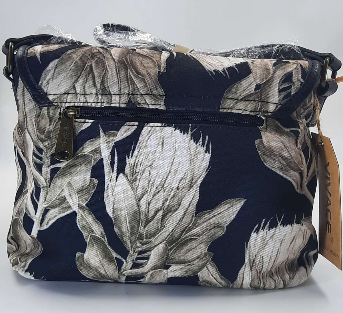 Stunning,Sophisticated And Trendy Shouder Sling Bag BY Vivace ! Black and white Protea design.