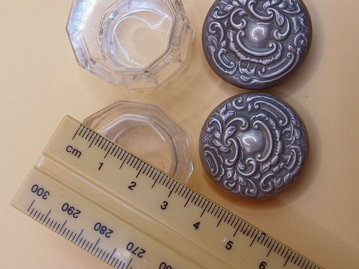 Two small marked silver and glass vanity jars lion facing left