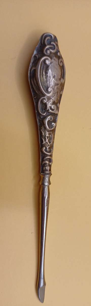 Marked silver lion facing left