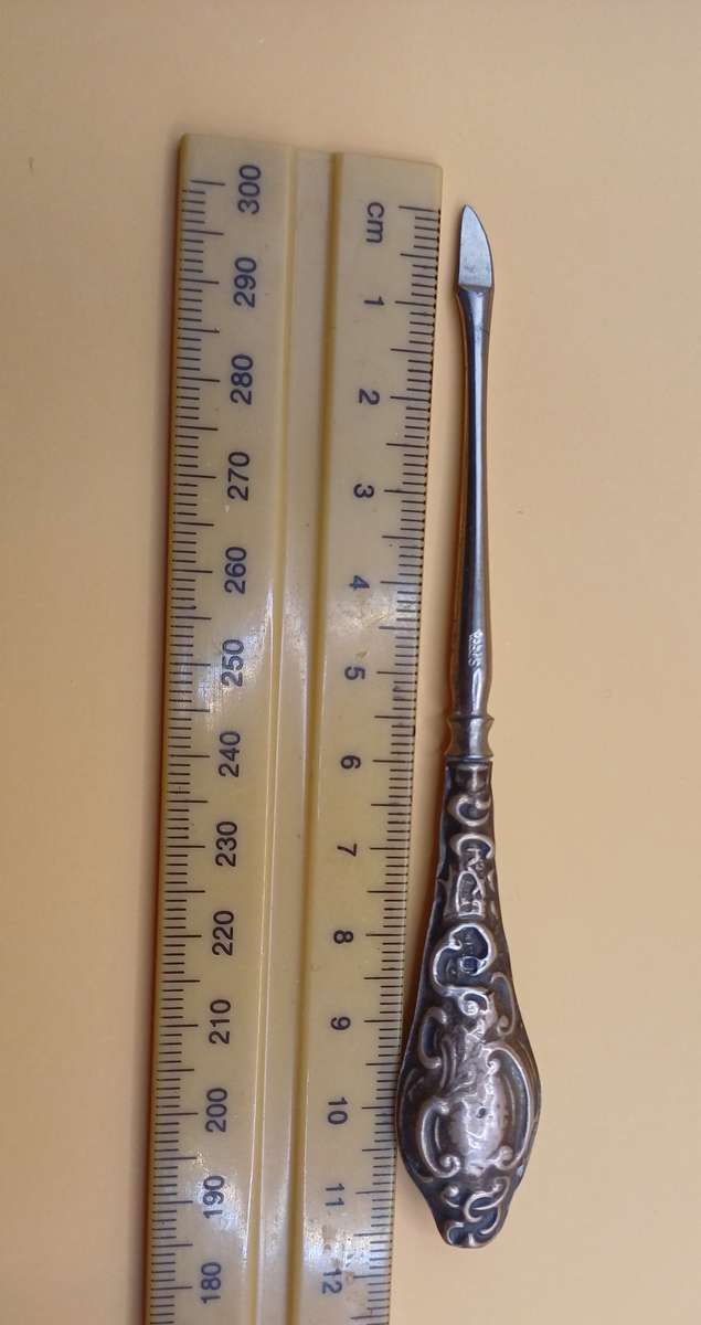 Marked silver lion facing left