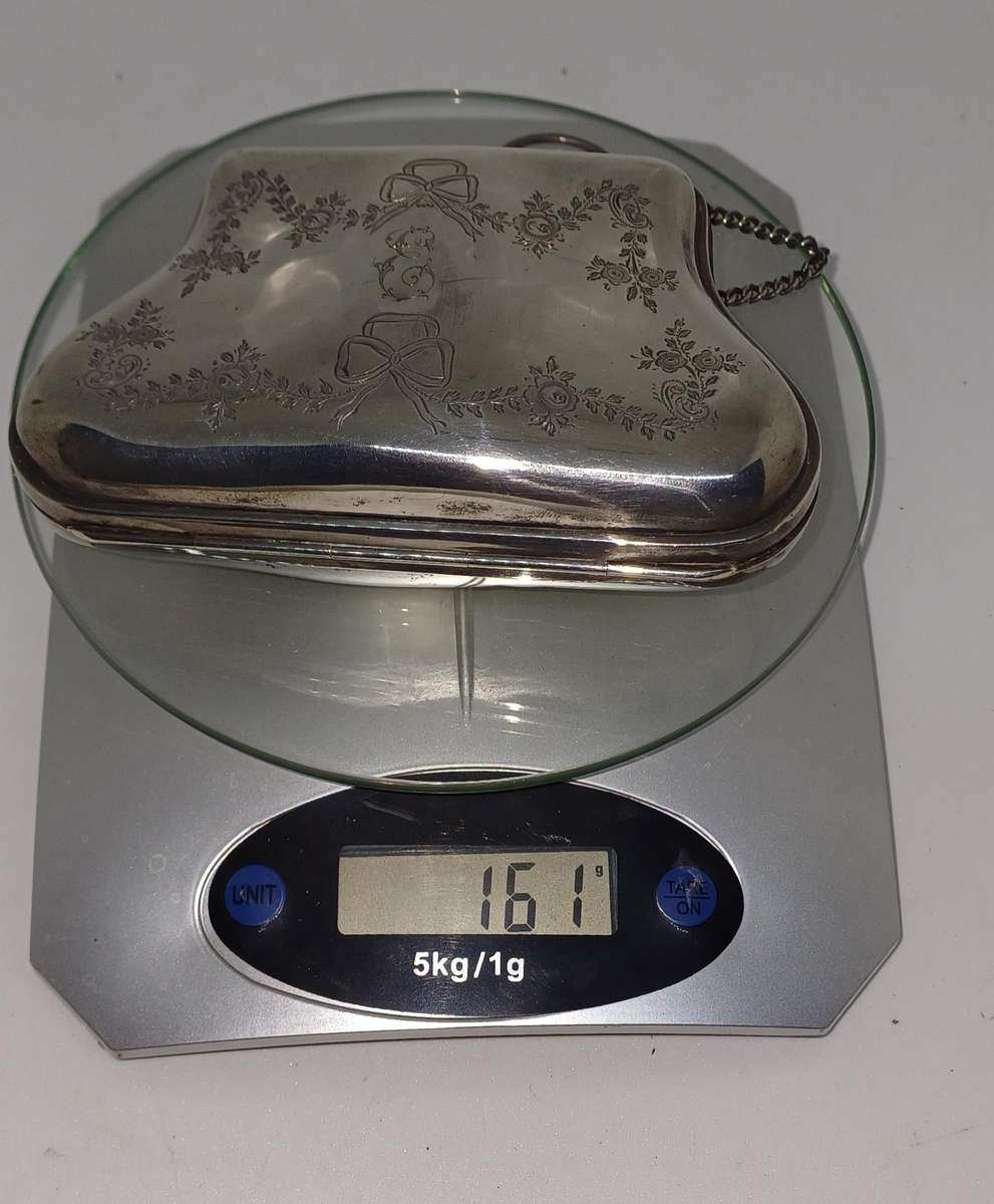 Antique silver coin purse marked with lion facing left