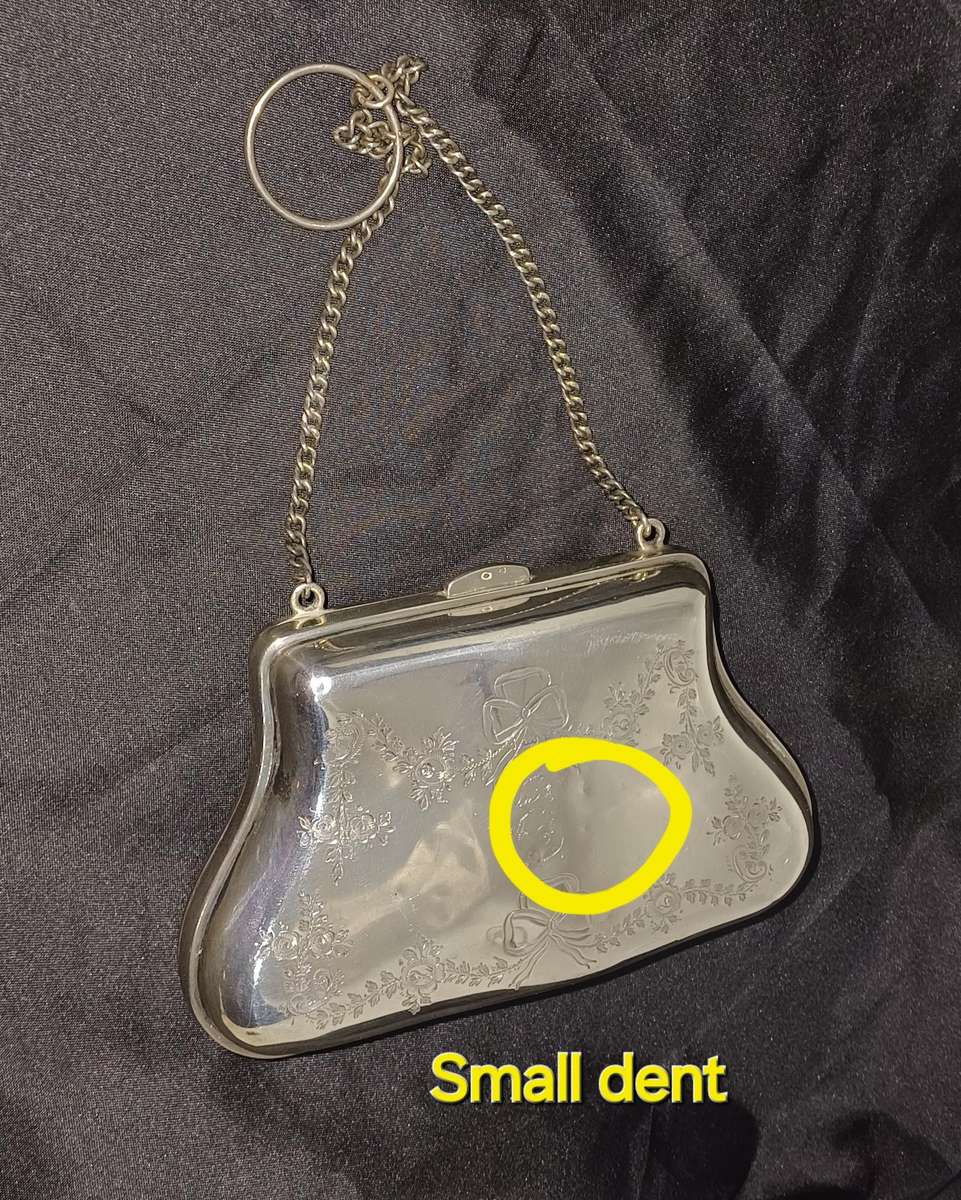 Antique silver coin purse marked with lion facing left