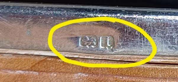 Antique silver coin purse marked with lion facing left