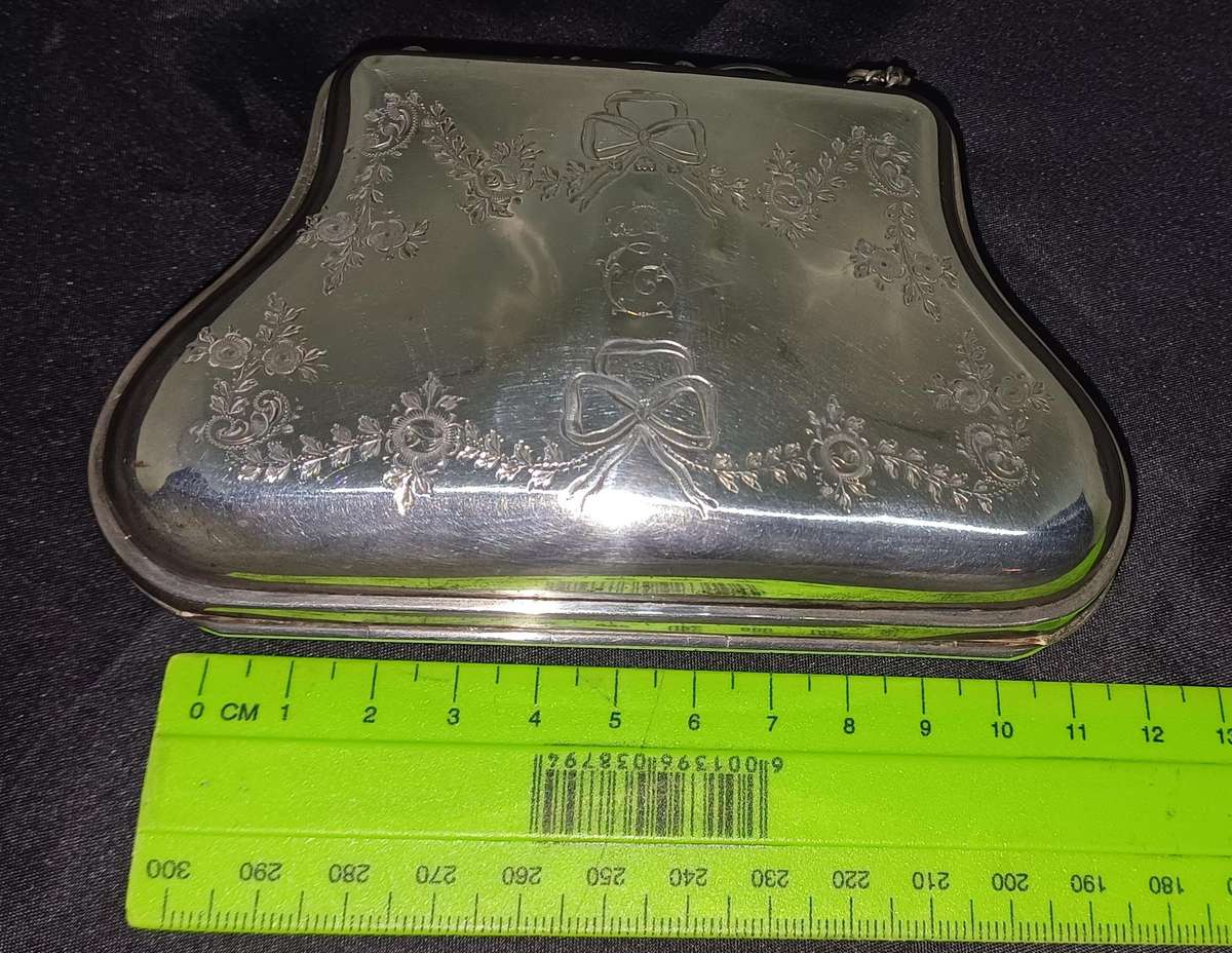 Antique silver coin purse marked with lion facing left