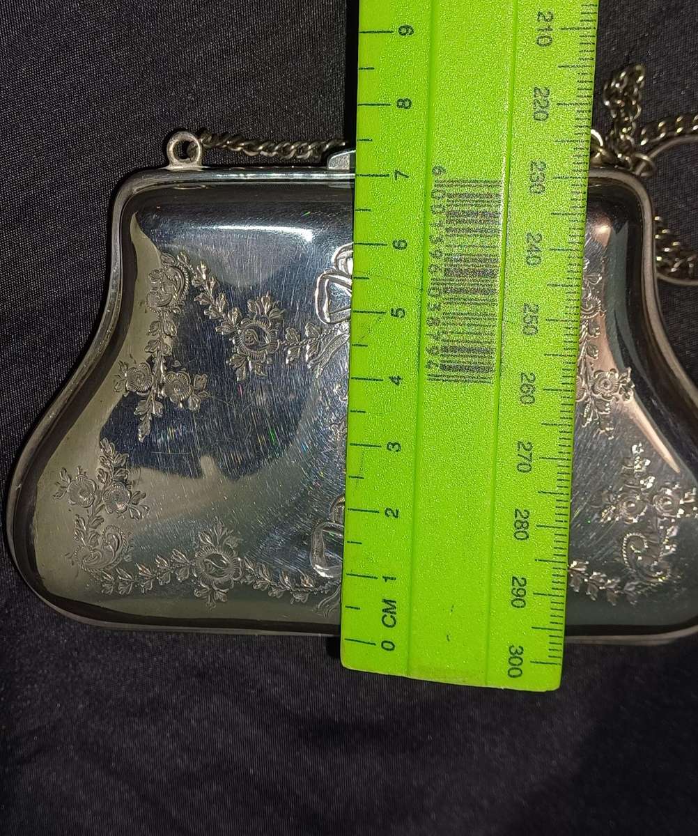 Antique silver coin purse marked with lion facing left