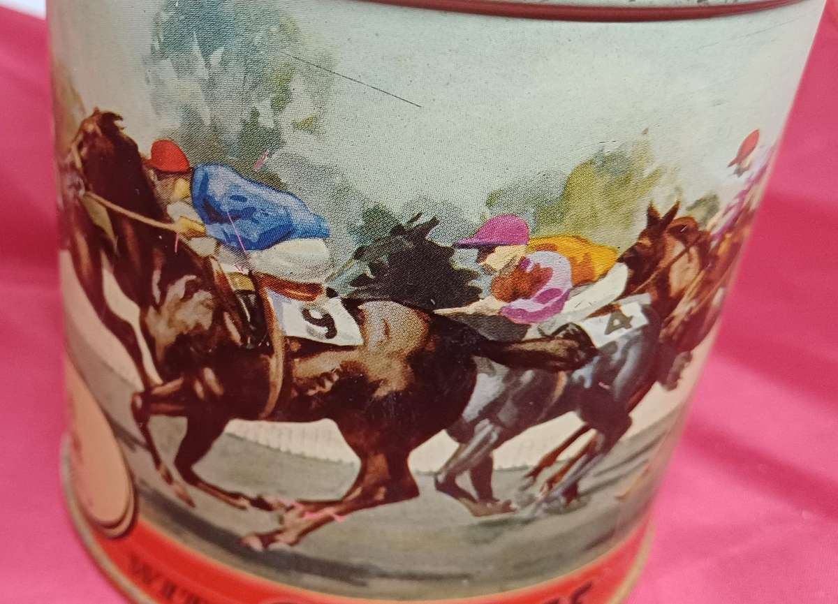 Collectable tin full of vintage plastic charms