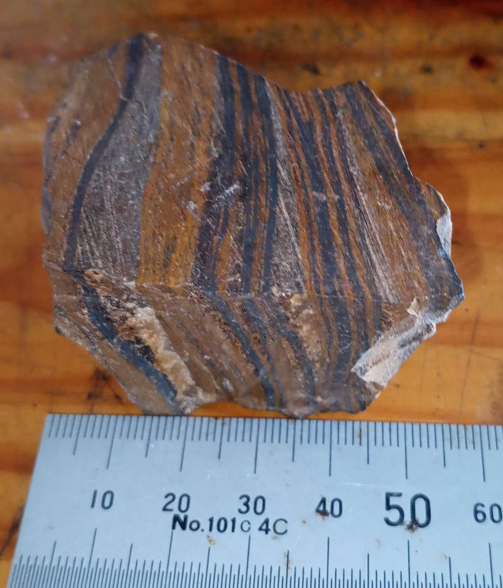 Mugglestone,  ( Tiger Iron), is a unique combination of Tigers Eye, Red Jasper, and Hematite