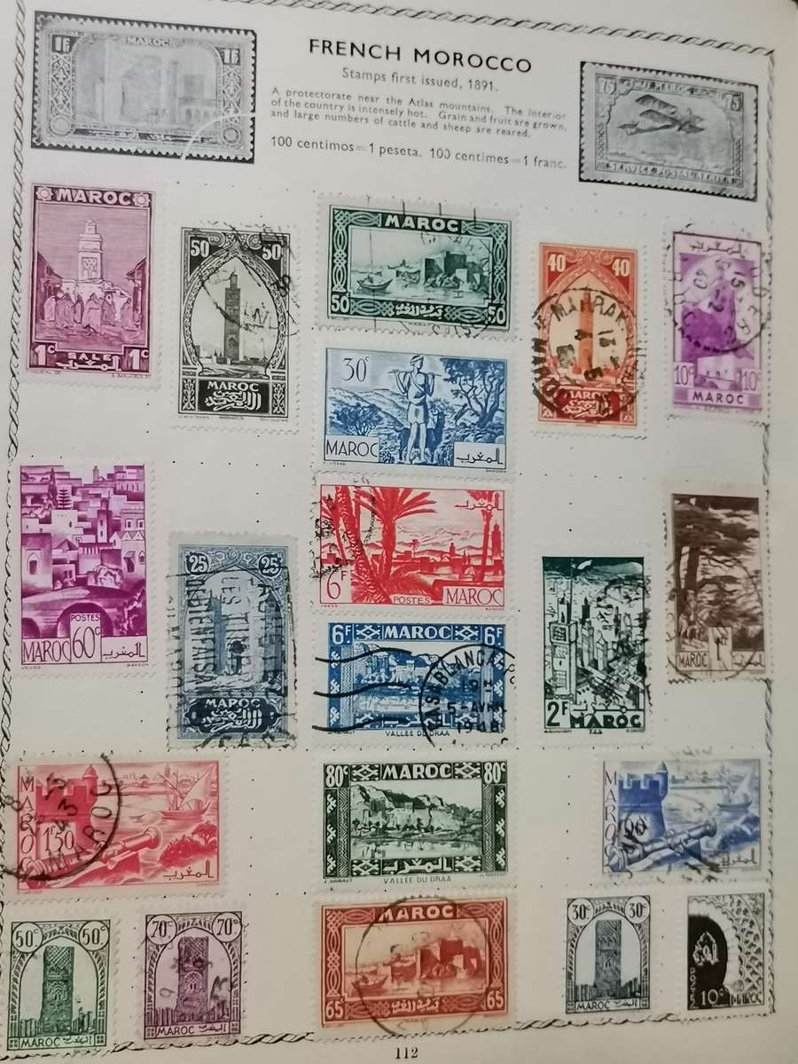 VINATGE POST WWII WORLD STAMP ALBUM WITH STAMPS.