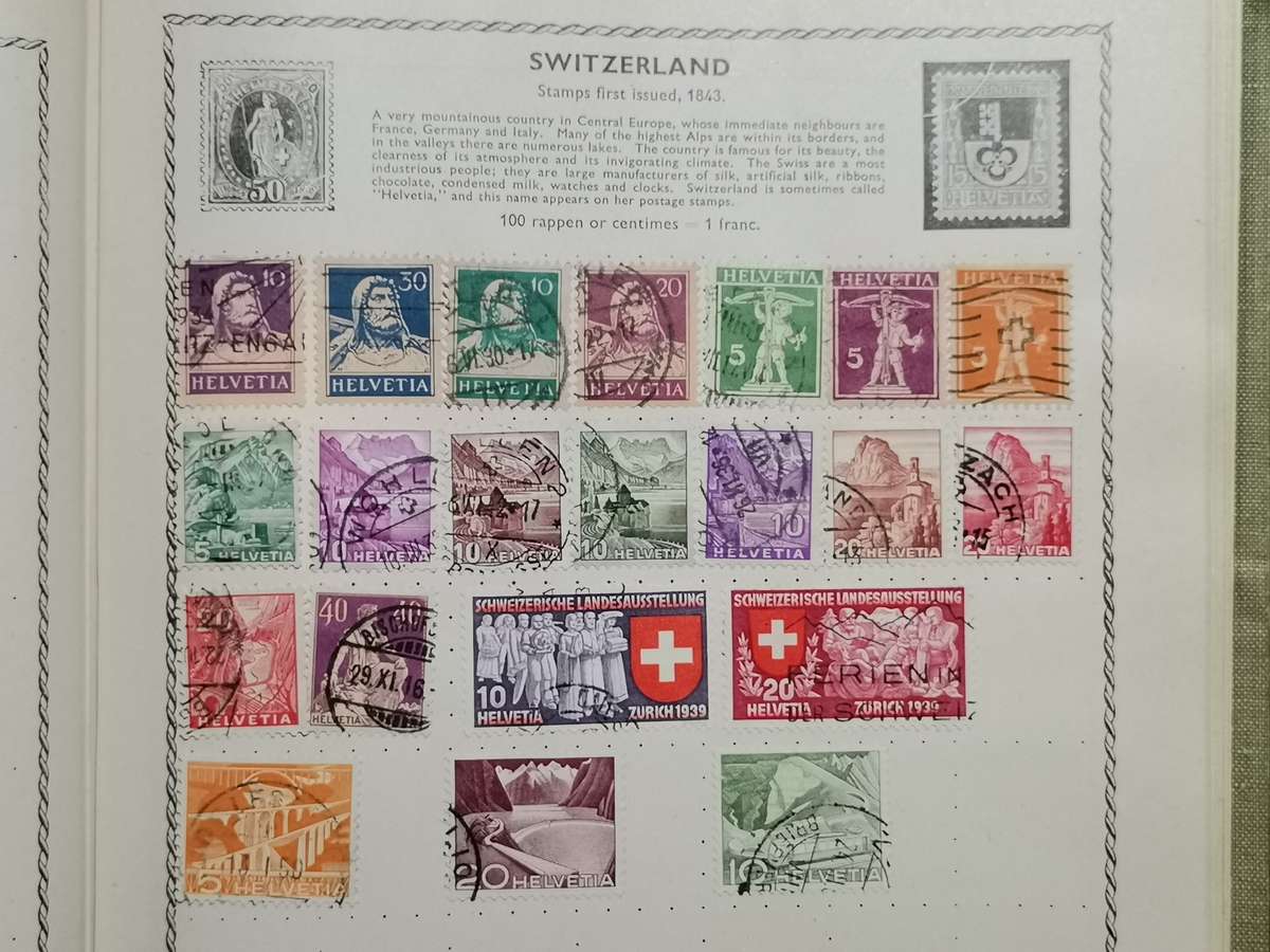 VINATGE POST WWII WORLD STAMP ALBUM WITH STAMPS.