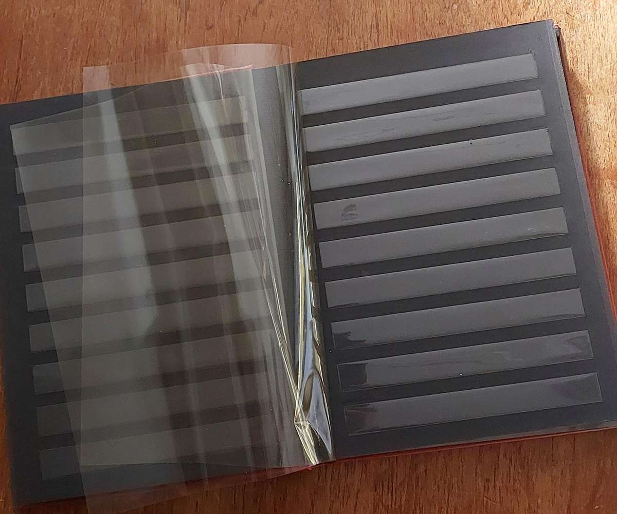 Stamp Album. Empty, 8 x d/sided black pages