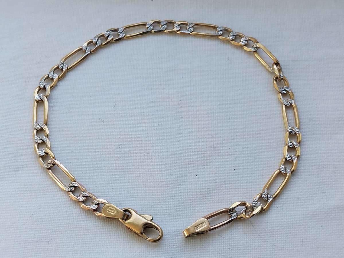 GENUINE 9 CT GOLD FIGARO-LINK BRACELET.