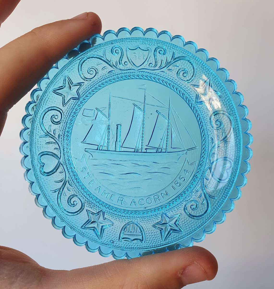 Streamer Acorn 1854 Boat Display on Blue Glass from Sandwich Glass Museum